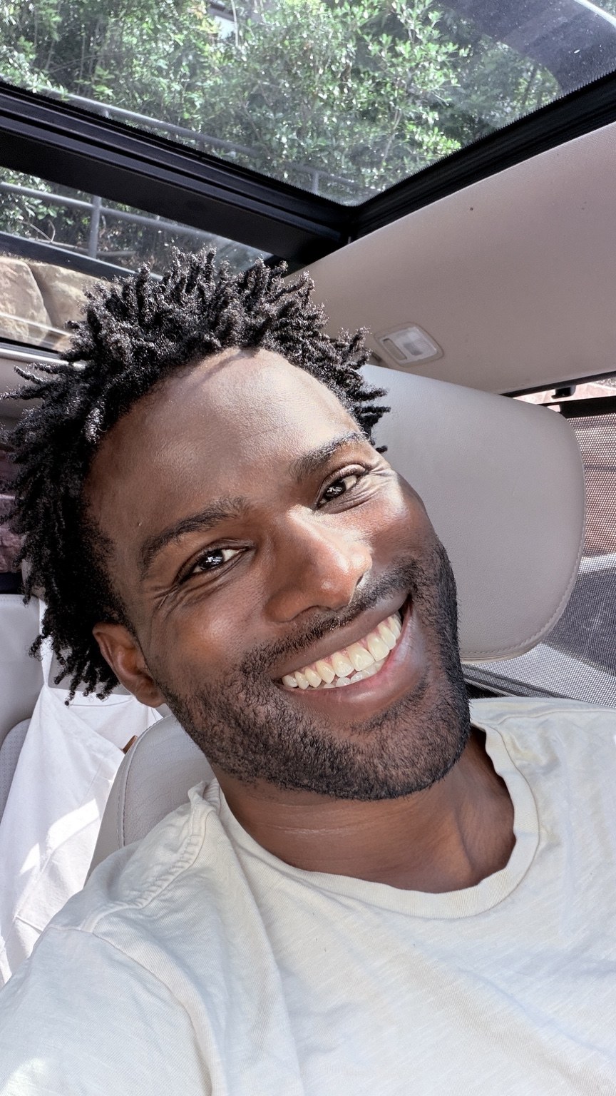 Phil BeLight smiling in natural light